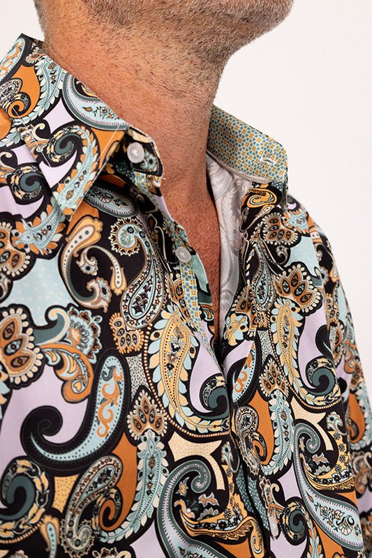 Close-up of a collared paisley patterned shirt.