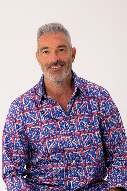 Man wearing a union jack patterned shirt on a white background