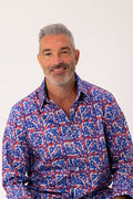 Man wearing a union jack patterned shirt on a white background